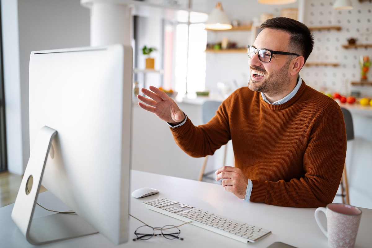 Man having video conferencing call via computer. Working remotely managing team and work from home