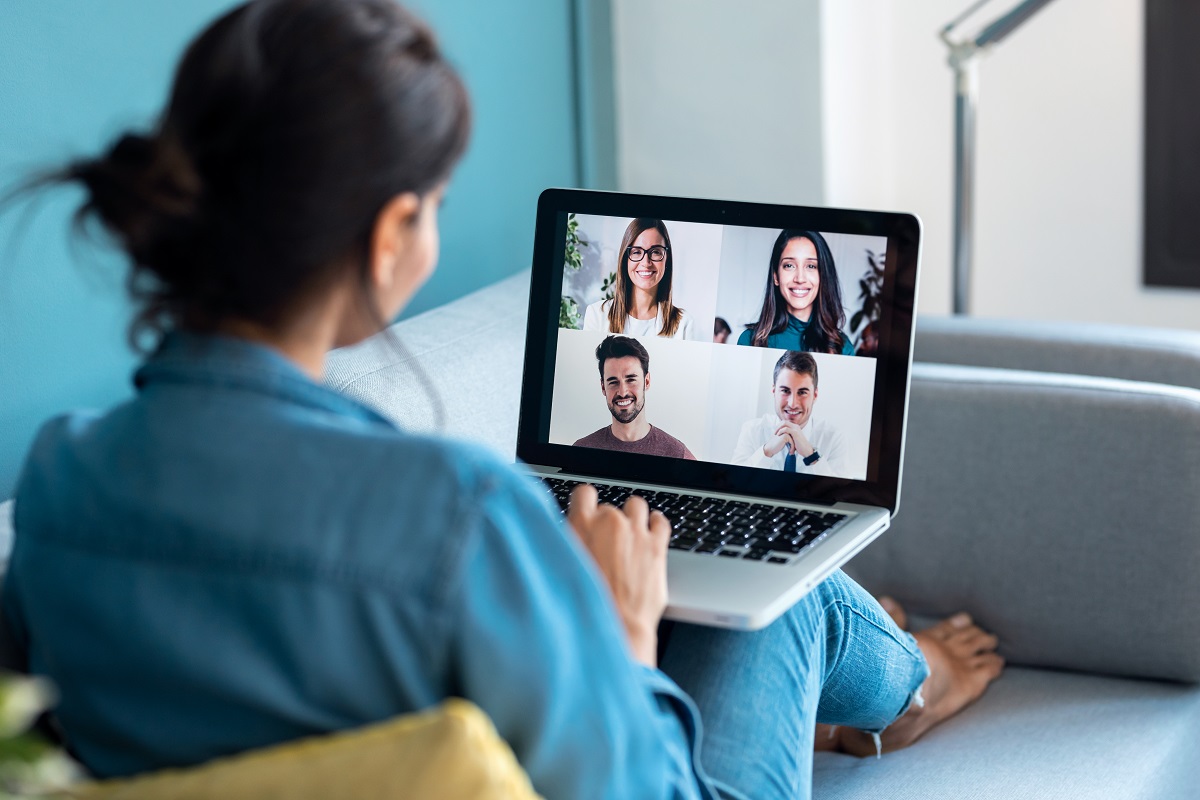 Business woman speaking on video call with diverse colleagues on